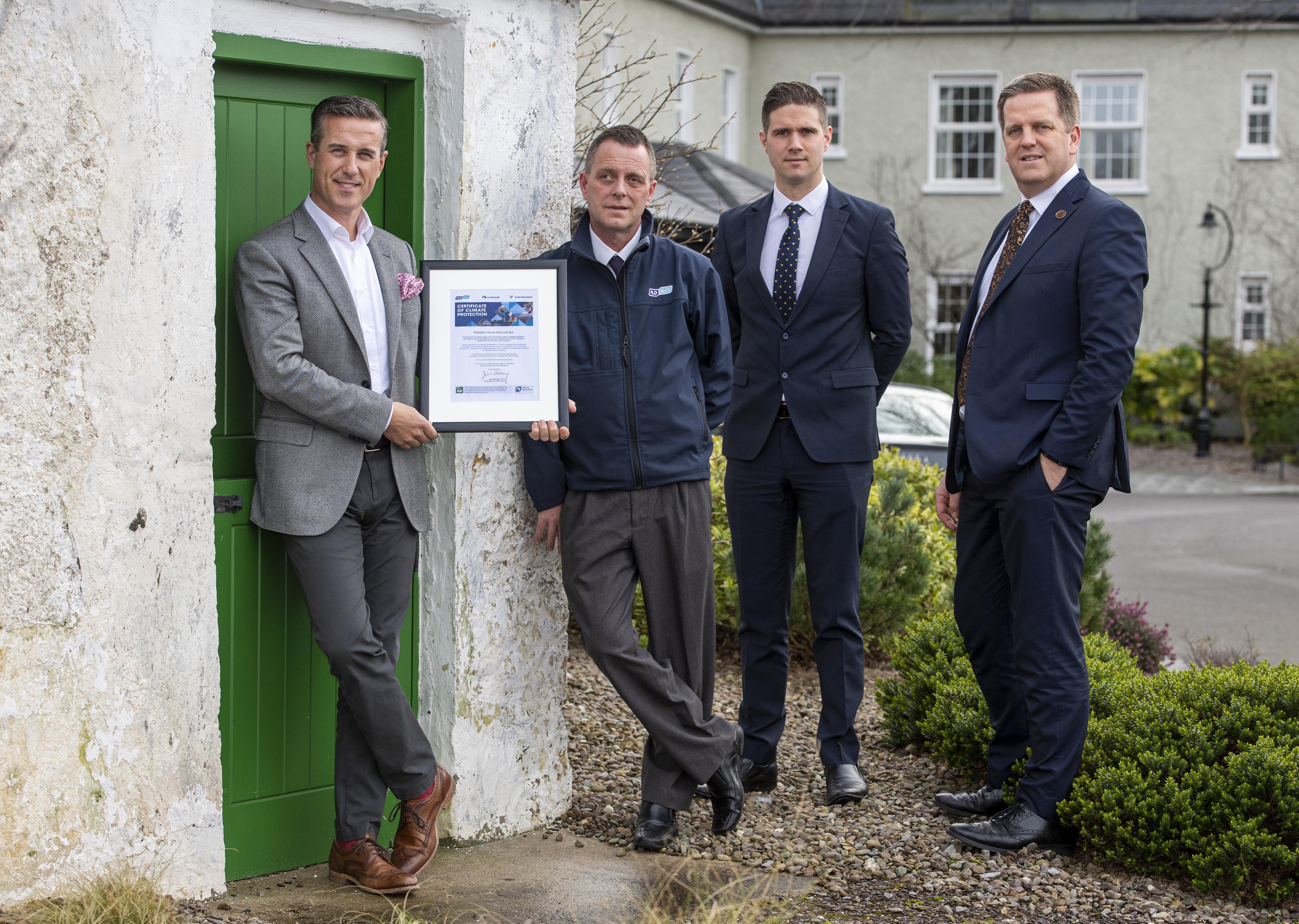 adraig McGillicuddy proprietor and general manager; Michael Murphy, area sales representative, Flogas; Tadgh McGillicuddy, assistant manager and Thys Vogels, hotel manager holding Flogas Carbon Offsetting Certificate